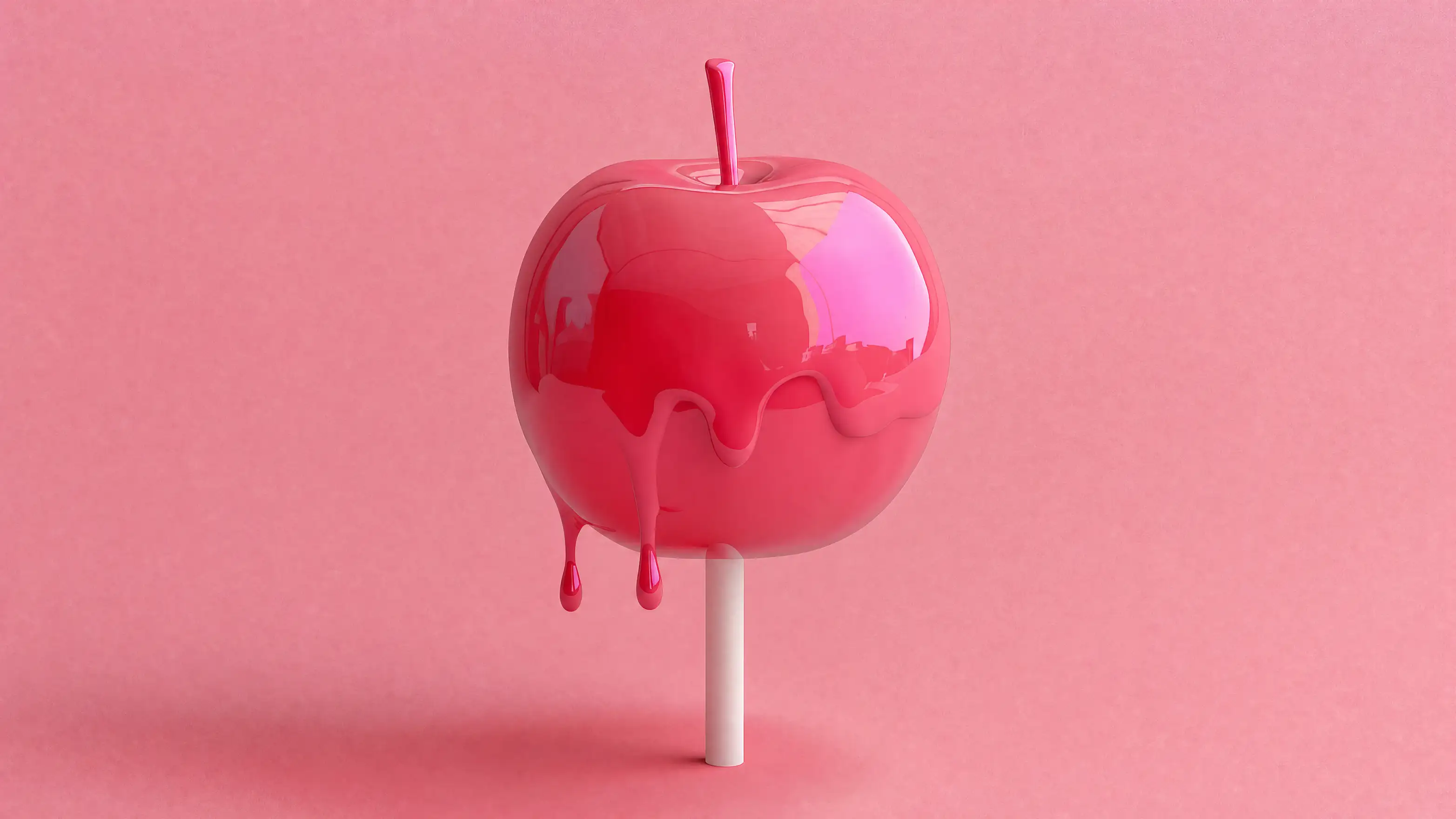 A glossy red candy apple on a stick, dripping, against a pink background